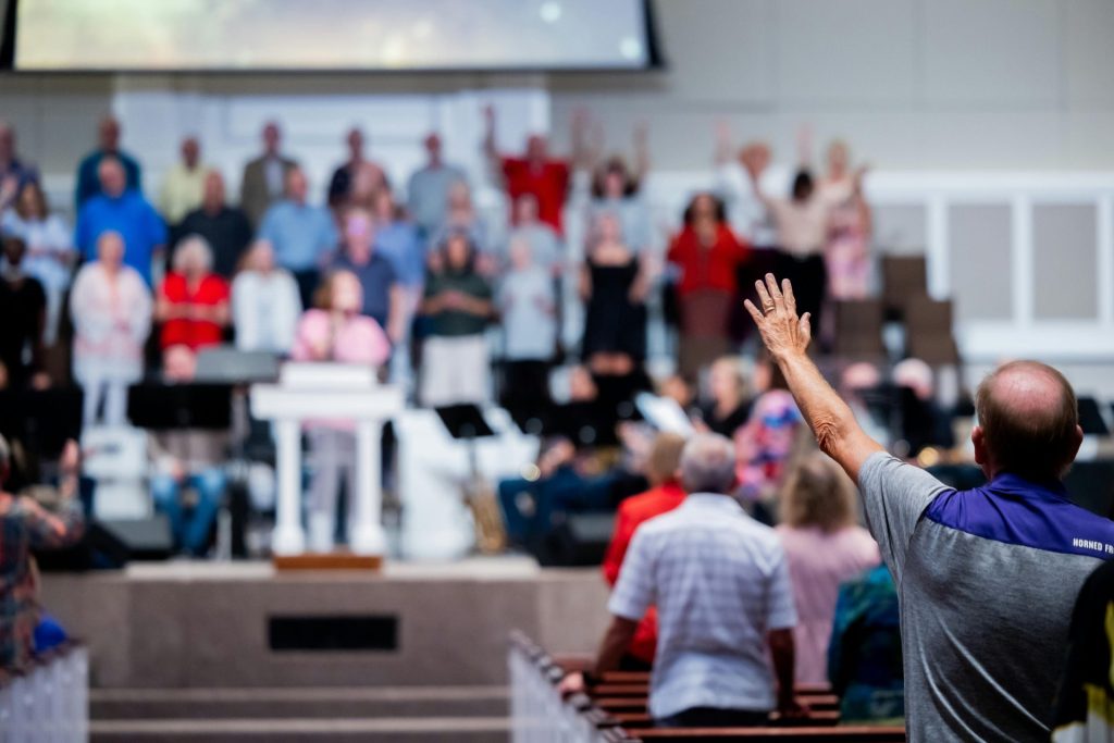 A church congregation participates in a worship service with a focus on community and spirituality.